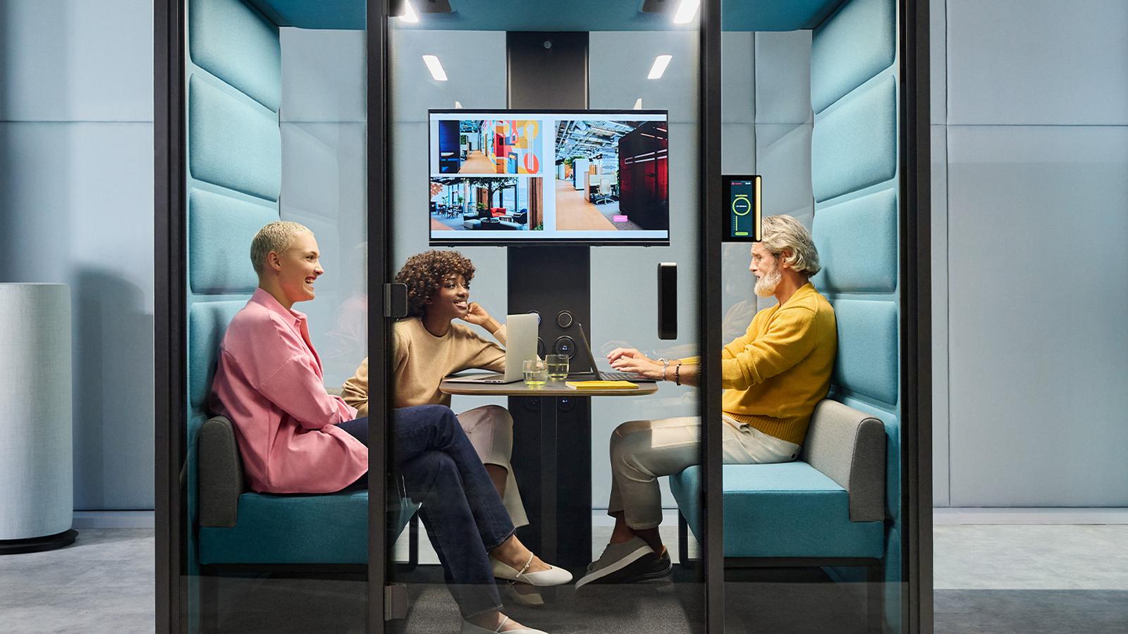 An OULIV acoustic meeting pod in use in an open-plan workplace